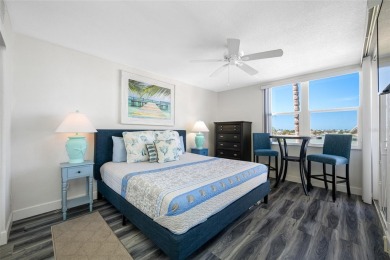Stunning end unit offering water views galore!  This turnkey on Isla Del Sol Yacht and Country Club in Florida - for sale on GolfHomes.com, golf home, golf lot
