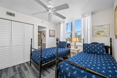 Stunning end unit offering water views galore!  This turnkey on Isla Del Sol Yacht and Country Club in Florida - for sale on GolfHomes.com, golf home, golf lot