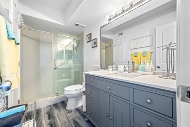 Stunning end unit offering water views galore!  This turnkey on Isla Del Sol Yacht and Country Club in Florida - for sale on GolfHomes.com, golf home, golf lot