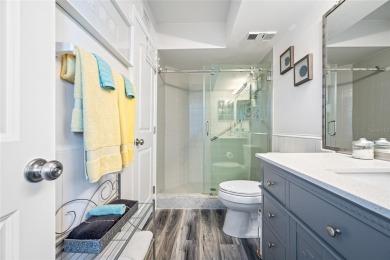 Stunning end unit offering water views galore!  This turnkey on Isla Del Sol Yacht and Country Club in Florida - for sale on GolfHomes.com, golf home, golf lot