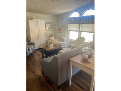 This home has been thoughtfully updated with laminate and tile on Hamptons Golf Club in Florida - for sale on GolfHomes.com, golf home, golf lot