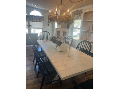 This home has been thoughtfully updated with laminate and tile on Hamptons Golf Club in Florida - for sale on GolfHomes.com, golf home, golf lot