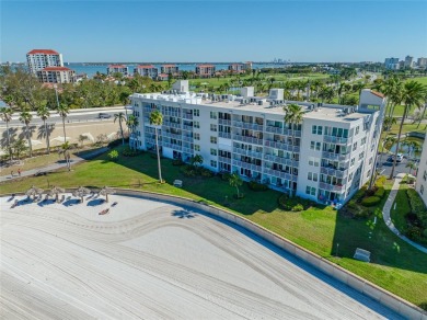 Stunning end unit offering water views galore!  This turnkey on Isla Del Sol Yacht and Country Club in Florida - for sale on GolfHomes.com, golf home, golf lot