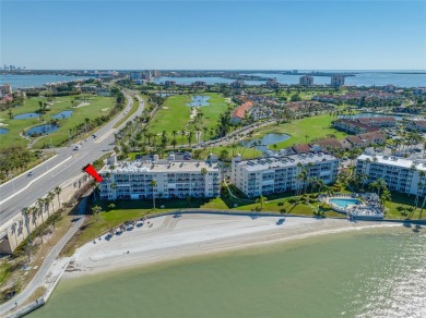 Stunning end unit offering water views galore!  This turnkey on Isla Del Sol Yacht and Country Club in Florida - for sale on GolfHomes.com, golf home, golf lot