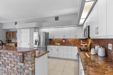Tucked away among tree-lined streets and mature landscaping in on River Wilderness Golf and Country Club in Florida - for sale on GolfHomes.com, golf home, golf lot