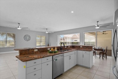 Tucked away among tree-lined streets and mature landscaping in on River Wilderness Golf and Country Club in Florida - for sale on GolfHomes.com, golf home, golf lot