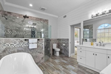 Tucked away among tree-lined streets and mature landscaping in on River Wilderness Golf and Country Club in Florida - for sale on GolfHomes.com, golf home, golf lot