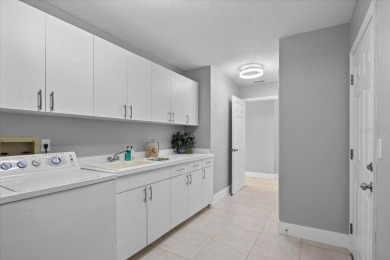 Tucked away among tree-lined streets and mature landscaping in on River Wilderness Golf and Country Club in Florida - for sale on GolfHomes.com, golf home, golf lot