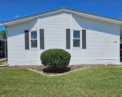 This home is on leased land and is located in a 55+ resort-style on Big Cypress Golf and Country Club in Florida - for sale on GolfHomes.com, golf home, golf lot