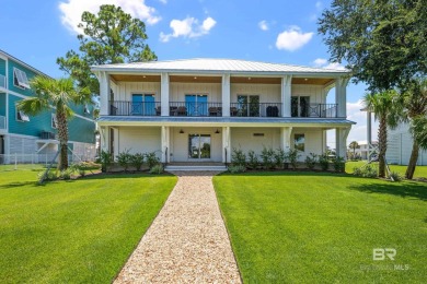 Tucked along one of Orange Beach's most sought-after waterfront on Orange Beach Golf Center in Alabama - for sale on GolfHomes.com, golf home, golf lot