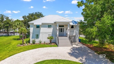 Tucked along one of Orange Beach's most sought-after waterfront on Orange Beach Golf Center in Alabama - for sale on GolfHomes.com, golf home, golf lot