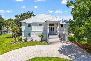 Tucked along one of Orange Beach's most sought-after waterfront on Orange Beach Golf Center in Alabama - for sale on GolfHomes.com, golf home, golf lot