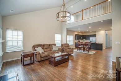 This stunning home is filled with natural light, highlighting on Highland Creek Golf Club in North Carolina - for sale on GolfHomes.com, golf home, golf lot