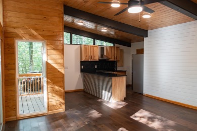 Amid towering hemlocks, this modern cabin reveals the quiet on Hide-A-Way Hills Golf Club in Ohio - for sale on GolfHomes.com, golf home, golf lot