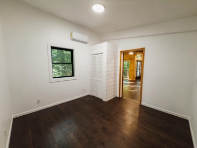 Amid towering hemlocks, this modern cabin reveals the quiet on Hide-A-Way Hills Golf Club in Ohio - for sale on GolfHomes.com, golf home, golf lot