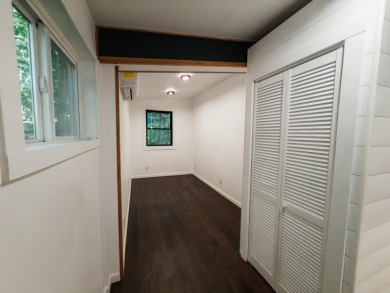 Amid towering hemlocks, this modern cabin reveals the quiet on Hide-A-Way Hills Golf Club in Ohio - for sale on GolfHomes.com, golf home, golf lot