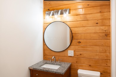 Amid towering hemlocks, this modern cabin reveals the quiet on Hide-A-Way Hills Golf Club in Ohio - for sale on GolfHomes.com, golf home, golf lot