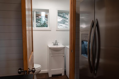Amid towering hemlocks, this modern cabin reveals the quiet on Hide-A-Way Hills Golf Club in Ohio - for sale on GolfHomes.com, golf home, golf lot