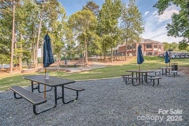 This stunning home is filled with natural light, highlighting on Highland Creek Golf Club in North Carolina - for sale on GolfHomes.com, golf home, golf lot