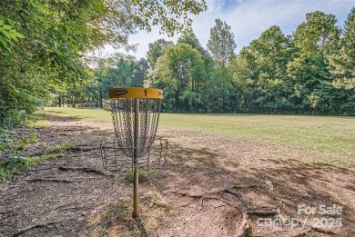 This stunning home is filled with natural light, highlighting on Highland Creek Golf Club in North Carolina - for sale on GolfHomes.com, golf home, golf lot