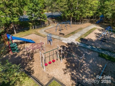 This stunning home is filled with natural light, highlighting on Highland Creek Golf Club in North Carolina - for sale on GolfHomes.com, golf home, golf lot