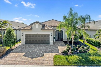 Discover the highly sought-after Martin Ray model with private on Sarasota National Golf Club in Florida - for sale on GolfHomes.com, golf home, golf lot
