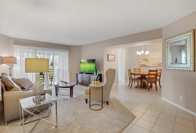 WELCOME TO THIS SPARKLING CONDO WITH EXPANSIVE GOLF VIEWS FROM A on Poinciana Golf Club in Florida - for sale on GolfHomes.com, golf home, golf lot