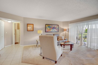 WELCOME TO THIS SPARKLING CONDO WITH EXPANSIVE GOLF VIEWS FROM A on Poinciana Golf Club in Florida - for sale on GolfHomes.com, golf home, golf lot