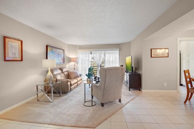 WELCOME TO THIS SPARKLING CONDO WITH EXPANSIVE GOLF VIEWS FROM A on Poinciana Golf Club in Florida - for sale on GolfHomes.com, golf home, golf lot