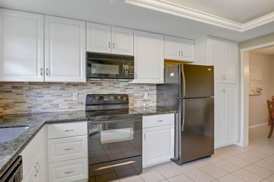 WELCOME TO THIS SPARKLING CONDO WITH EXPANSIVE GOLF VIEWS FROM A on Poinciana Golf Club in Florida - for sale on GolfHomes.com, golf home, golf lot