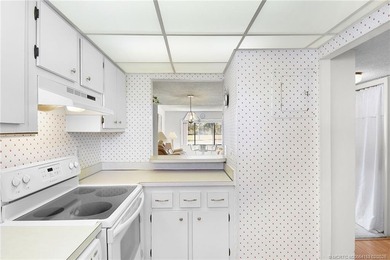 Second Floor 1/1.5 Condo with golf course views in Miles Grant on Miles Grant Country Club in Florida - for sale on GolfHomes.com, golf home, golf lot