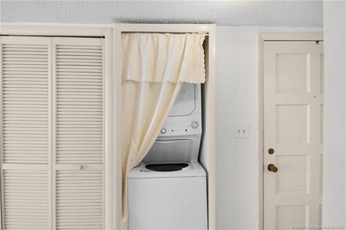 Second Floor 1/1.5 Condo with golf course views in Miles Grant on Miles Grant Country Club in Florida - for sale on GolfHomes.com, golf home, golf lot