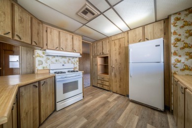 This is a 3 bedroom 2 bath manufactured home built in 1977 with on Churn Creek Golf Course in California - for sale on GolfHomes.com, golf home, golf lot