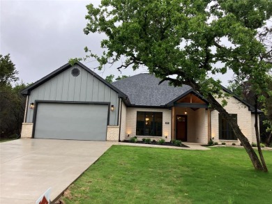 Beautiful home, has four bedrooms, three and half bathrooms. 2 on White Bluff Resort - New Course in Texas - for sale on GolfHomes.com, golf home, golf lot