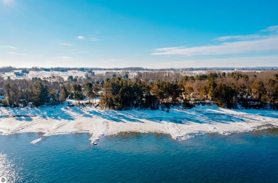 Usually, you have to choose between a golf course setting, water on Grand Traverse Resort and Spa in Michigan - for sale on GolfHomes.com, golf home, golf lot