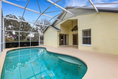 This beautiful POOL home is located in a gated, golf course on Ridgewood Lakes Golf and Country Club in Florida - for sale on GolfHomes.com, golf home, golf lot