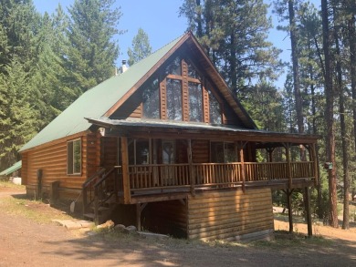 Explore the allure of log cabin living in this charming home on Meadowcreek Golf Resort in Idaho - for sale on GolfHomes.com, golf home, golf lot