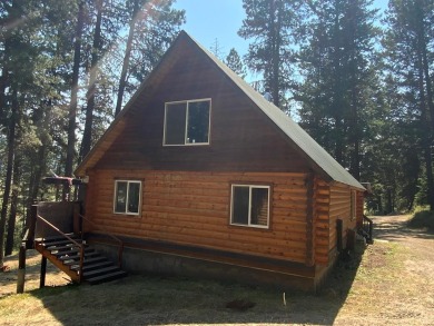 Explore the allure of log cabin living in this charming home on Meadowcreek Golf Resort in Idaho - for sale on GolfHomes.com, golf home, golf lot