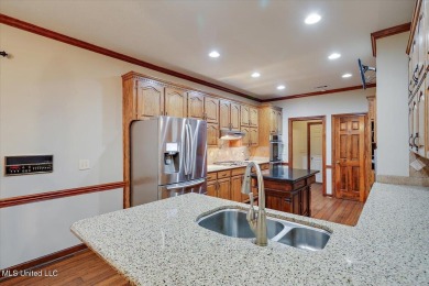 Discover this spacious 4-Bedroom, 2.5-bath home with at least on Castlewoods Golf Club in Mississippi - for sale on GolfHomes.com, golf home, golf lot