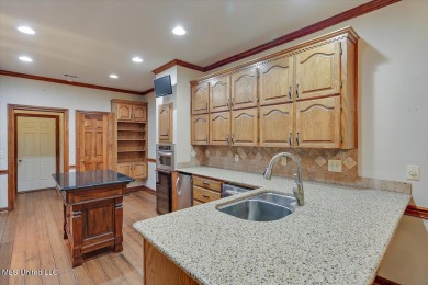 Discover this spacious 4-Bedroom, 2.5-bath home with at least on Castlewoods Golf Club in Mississippi - for sale on GolfHomes.com, golf home, golf lot