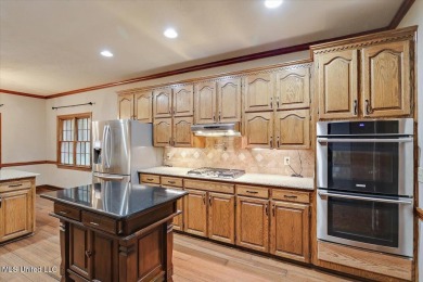 Discover this spacious 4-Bedroom, 2.5-bath home with at least on Castlewoods Golf Club in Mississippi - for sale on GolfHomes.com, golf home, golf lot