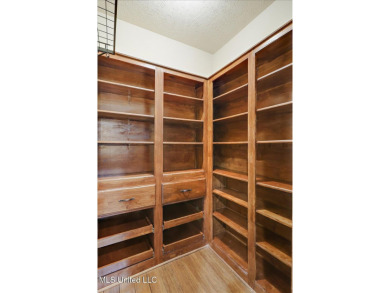 Discover this spacious 4-Bedroom, 2.5-bath home with at least on Castlewoods Golf Club in Mississippi - for sale on GolfHomes.com, golf home, golf lot