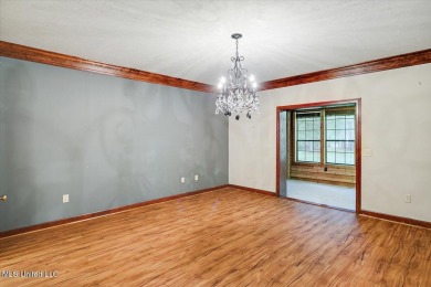 Discover this spacious 4-Bedroom, 2.5-bath home with at least on Castlewoods Golf Club in Mississippi - for sale on GolfHomes.com, golf home, golf lot