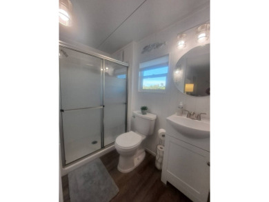 This Home Is Immaculate in Everyway ! Situated Right On the Lake on Riverwood Golf Club in Florida - for sale on GolfHomes.com, golf home, golf lot
