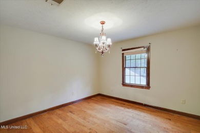 Discover this spacious 4-Bedroom, 2.5-bath home with at least on Castlewoods Golf Club in Mississippi - for sale on GolfHomes.com, golf home, golf lot
