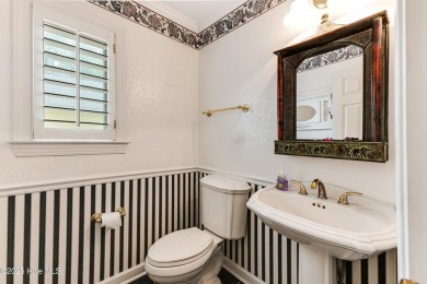 Welcome to this stately brick home overlooking the 11th hole of on Sea Trail Golf Resort in North Carolina - for sale on GolfHomes.com, golf home, golf lot