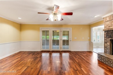 Welcome to this stately brick home overlooking the 11th hole of on Sea Trail Golf Resort in North Carolina - for sale on GolfHomes.com, golf home, golf lot