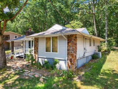 Are you in search of the perfect summer home or a welcoming on Indian Hills Country Club in Arkansas - for sale on GolfHomes.com, golf home, golf lot