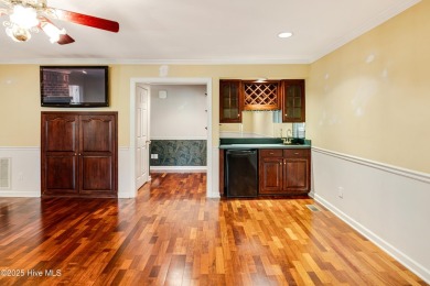 Welcome to this stately brick home overlooking the 11th hole of on Sea Trail Golf Resort in North Carolina - for sale on GolfHomes.com, golf home, golf lot