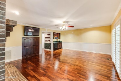 Welcome to this stately brick home overlooking the 11th hole of on Sea Trail Golf Resort in North Carolina - for sale on GolfHomes.com, golf home, golf lot